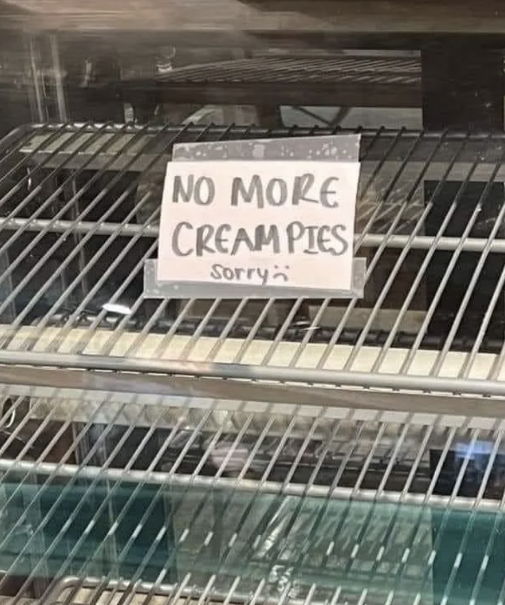 Handwritten sign in a display case reads &quot;NO MORE CREAMPIES Sorry :(&quot; indicating they are sold out