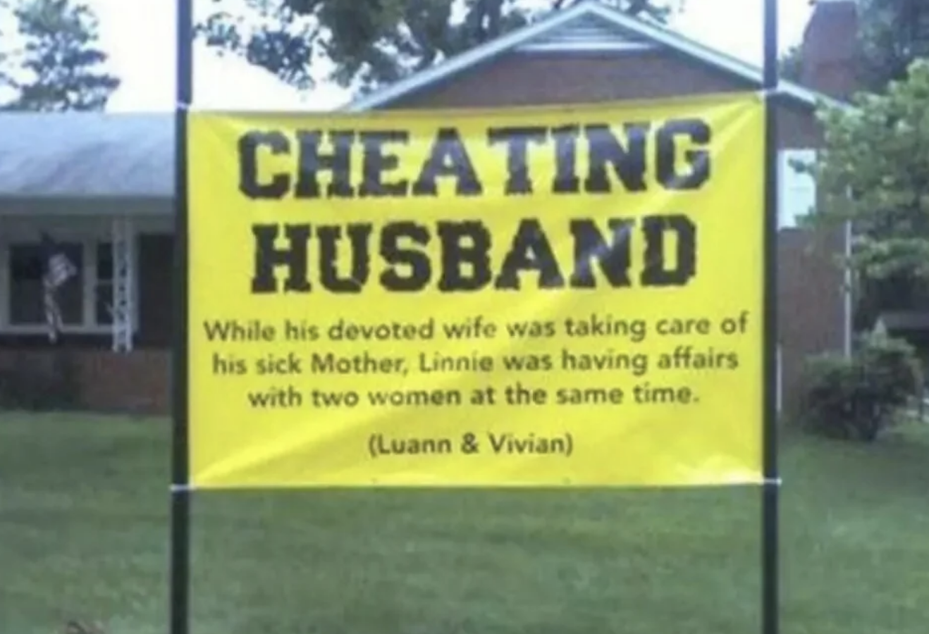 Banner accuses someone of cheating, with names and a specific scenario described. Displayed in front of a house