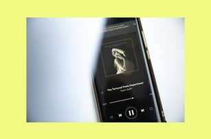 Smartphone screen showing a music player app with the album art for "The Tortured Poet Department" by taylor Swift