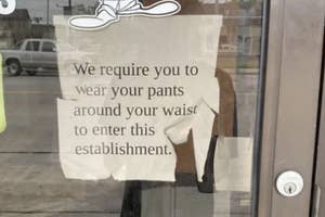 Sign on a door reads, "We require you to wear your pants around your waist to enter this establishment."