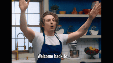 Chef in a blue apron enthusiastically welcomes viewers back to the cooking show. Text on image reads: "Welcome back to…"