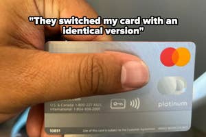 Hand holding a platinum credit card with a text overlay reading "They switched my card with an identical version"