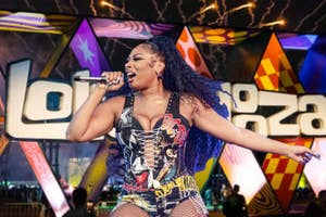 Megan Thee Stallion performing in front of a Lollapalooza sign.