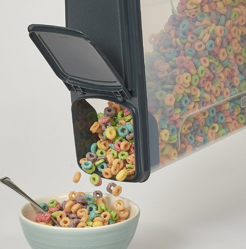 Plastic cereal dispenser pouring cereal into a bowl