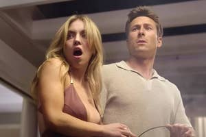 Sydney Sweeney and Glen Powell appear surprised and tense in a scene, wearing casual attire. Sydney wears a sleeveless outfit, and Glen is in a collared shirt