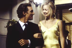 Matthew McConaughey in a dark suit and Kate Hudson in a sleeveless dress smiling, arm-in-arm, outside a building at night