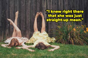 Two people lying on their backs with legs against a wooden fence, flowers nearby. Text reads, "I knew right there that she was just straight-up mean."
