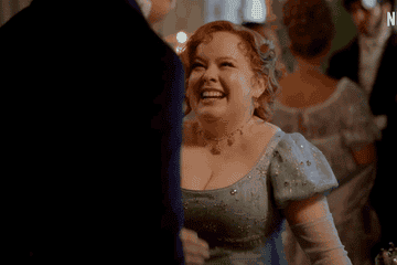 Colin and Penelope in Bridgerton season three laughing at a ball