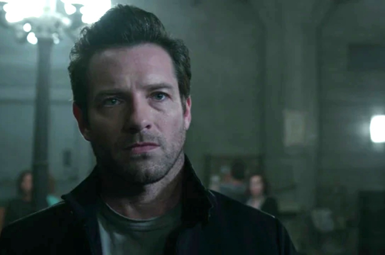 Photo of Ben Affleck as Bruce Wayne in a scene from a Batman film, looking intently forward