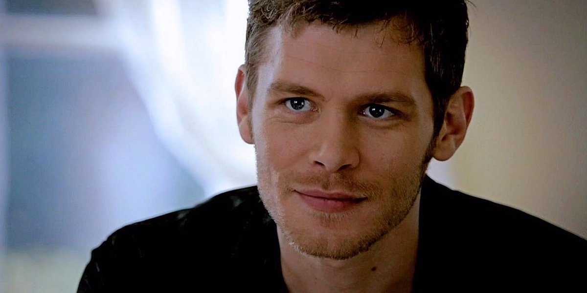 Actor Joseph Morgan in character, giving a slight smile in a scene from the TV show