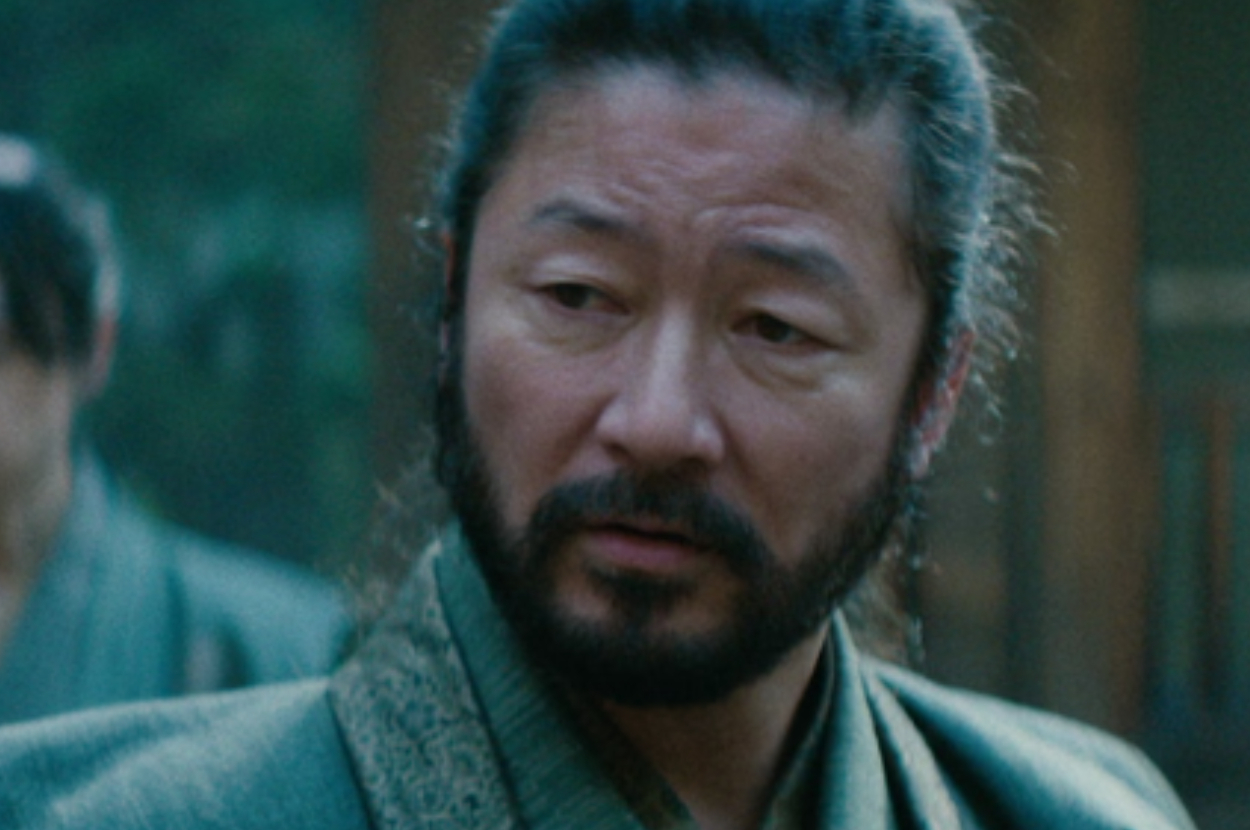 A close-up of an actor expressing concern in a period drama scene