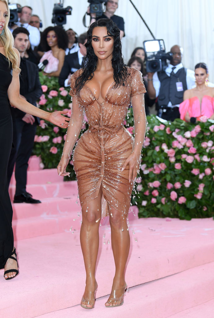 Kim in a wet-look dress with droplet embellishments at a formal event