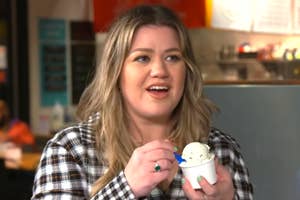 Kelly Clarkson holding a cup of ice cream