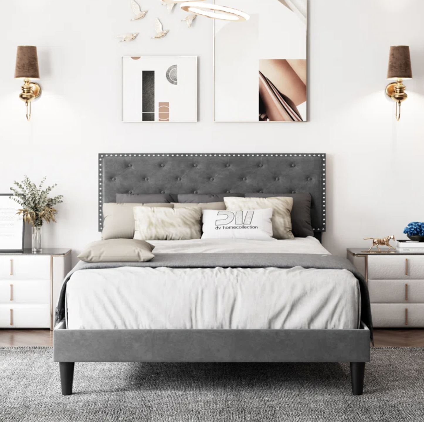 A modern bedroom with an upholstered bed, two nightstands, artwork, and decorative lighting for a sleek look