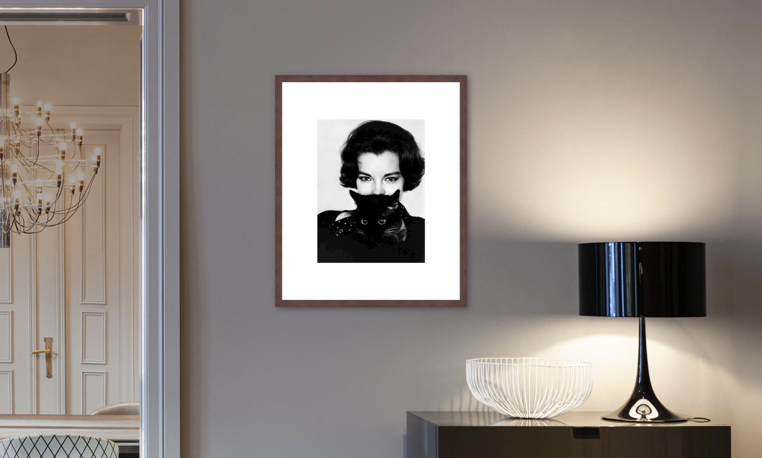 Framed black and white portrait of Audrey Hepburn in a modern living room setup
