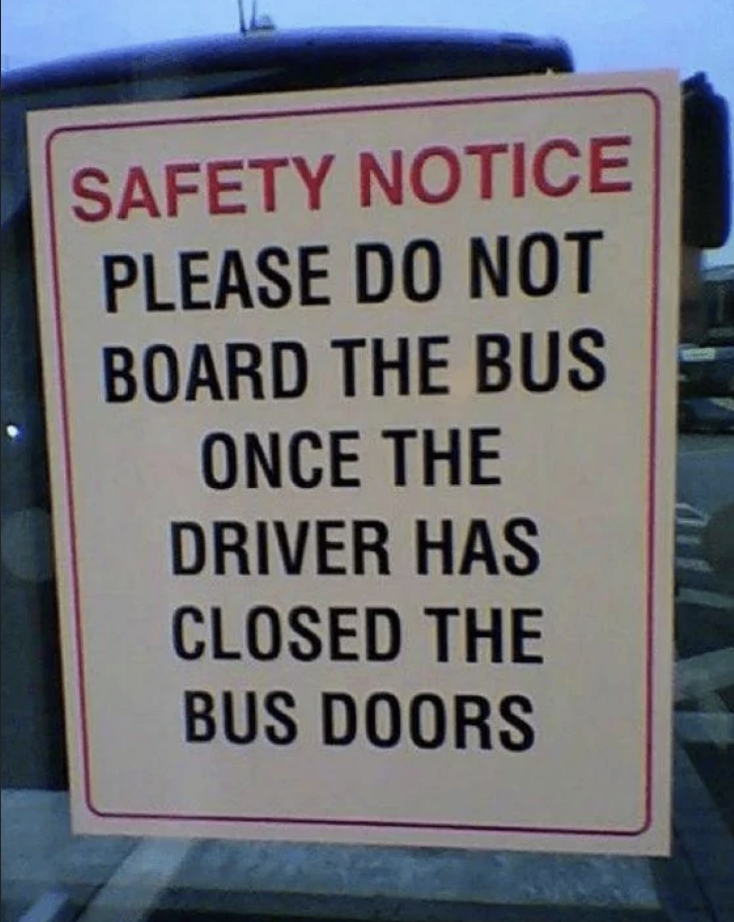 Sign reads: &quot;SAFETY NOTICE PLEASE DO NOT BOARD THE BUS ONCE THE DRIVER HAS CLOSED THE BUS DOORS&quot;
