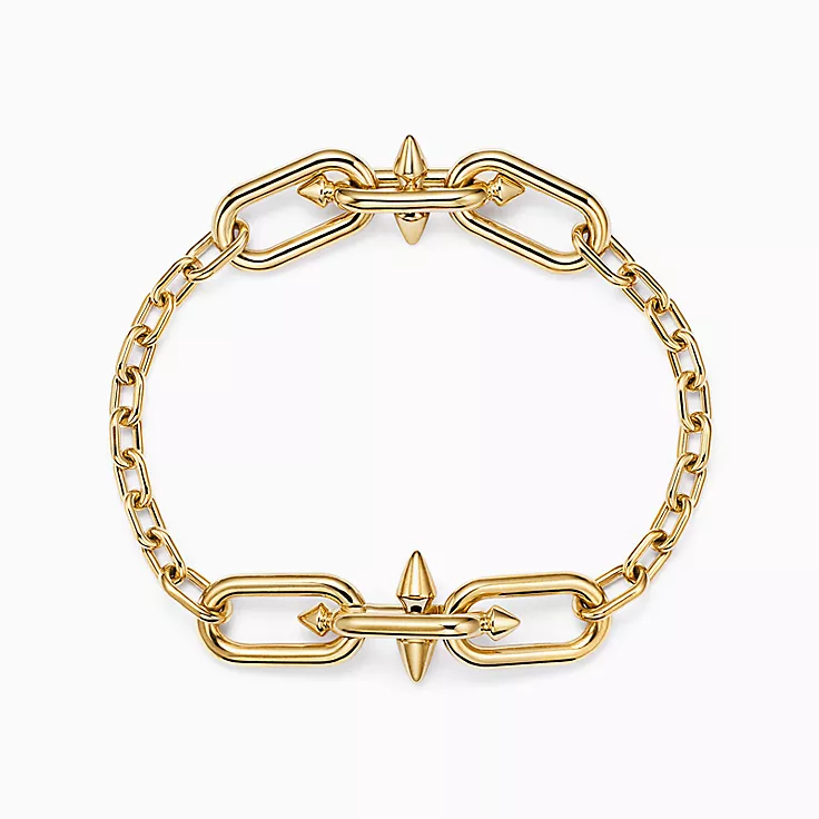 Gold link bracelet with spiked detail on the clasp
