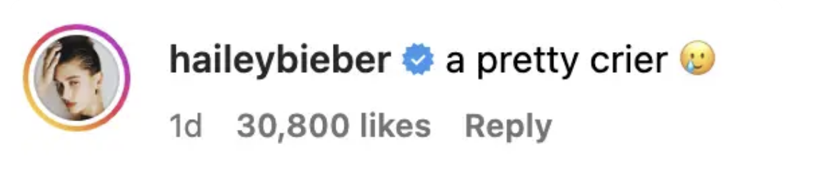 Instagram comment by user haileybieber with the text &quot;a pretty crier&quot; followed by a side-looking face emoji, indicating humor