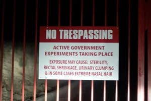Sign warning against trespassing due to government experiments, listing humorous potential side effects