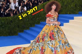 Zendaya on the Met Gala stairs in a floral off-shoulder gown with photographers in the background. Text: "Z in 2017"