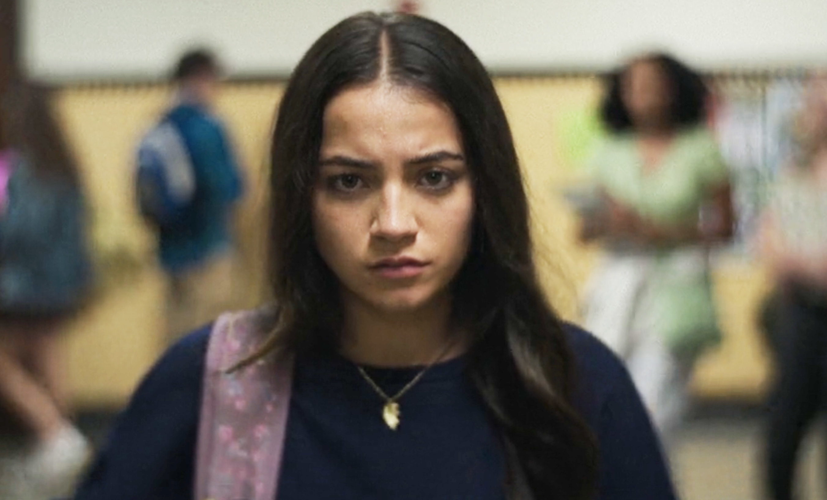 Close-up of Euphoria character Rue Bennett looking concerned in a school hallway