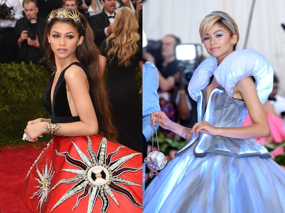 Zendaya con vestido largo y tocado dorado, y Janelle Monáe con vestido inflado azul, en evento de gala