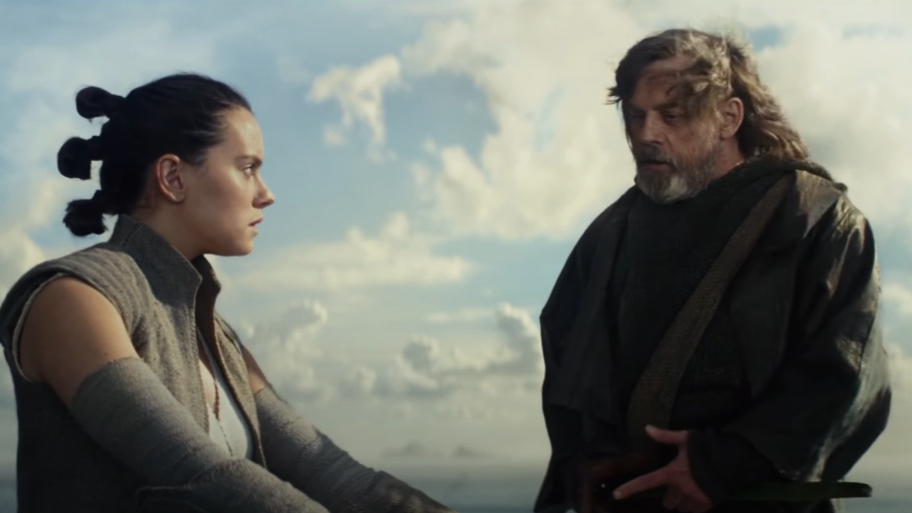 Rey and Luke Skywalker from Star Wars facing each other, intense emotional expression