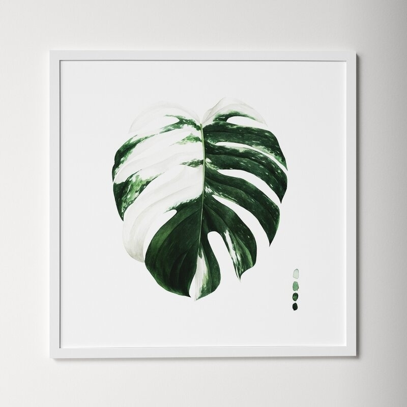 Framed wall art featuring a painted monstera leaf for home decor