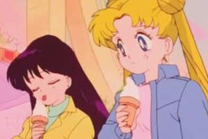 Animated characters Sailor Moon and Sailor Mars eating ice cream