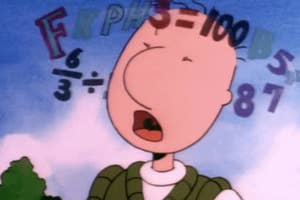 Charlie Brown looks worried as math equations float around his head