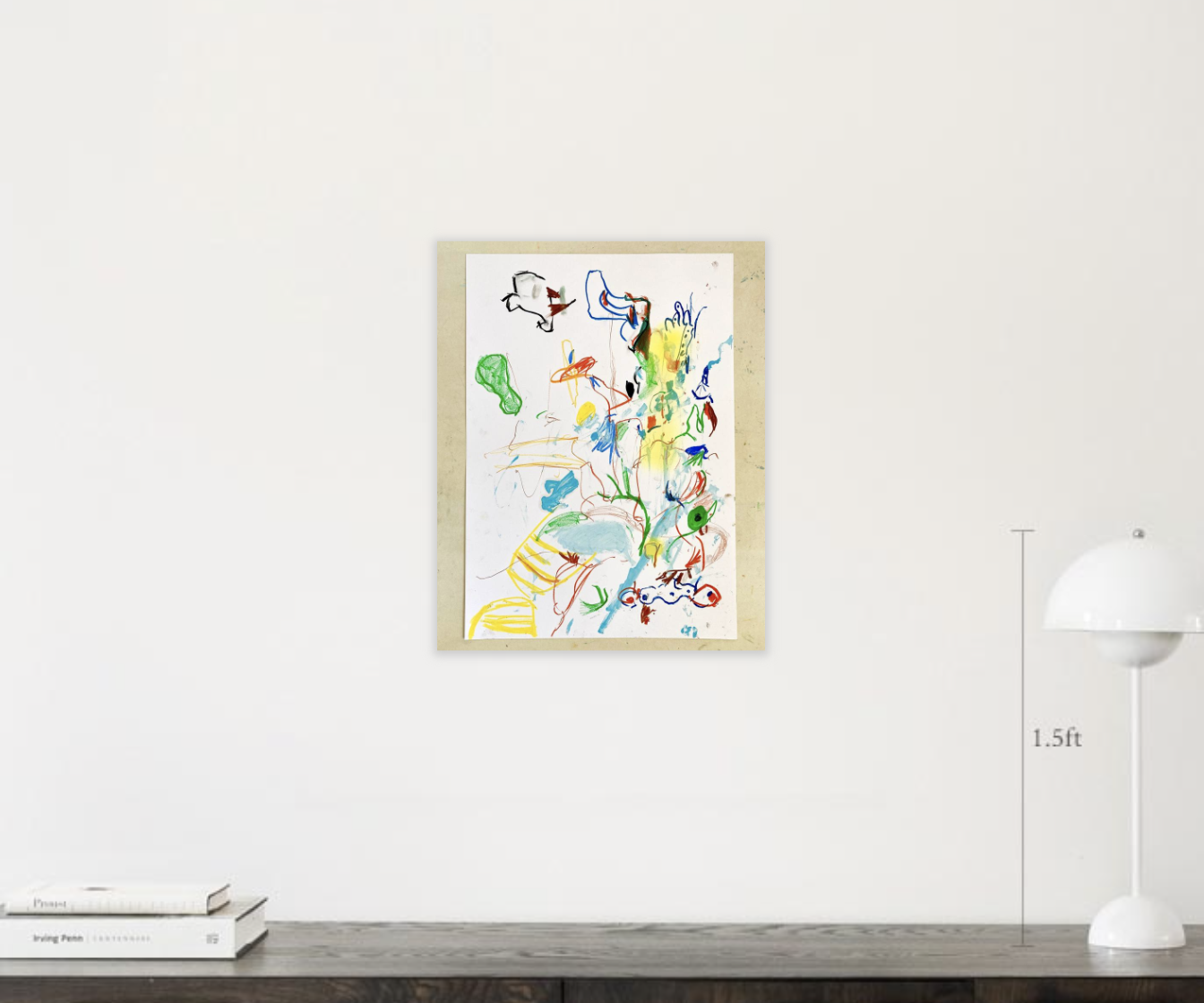 Framed abstract painting on a wall above a white book and lamp, showcasing a sale on home decor art