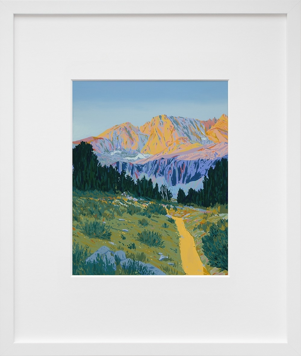 Framed painting of a mountain landscape with a trail leading towards snowy peaks, displayed for sale