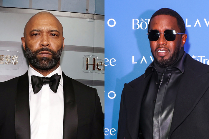Joe Budden in a tuxedo and bow tie on the left, Sean "Diddy" Combs in a dark overcoat and sunglasses on the right at a blue-carpet event