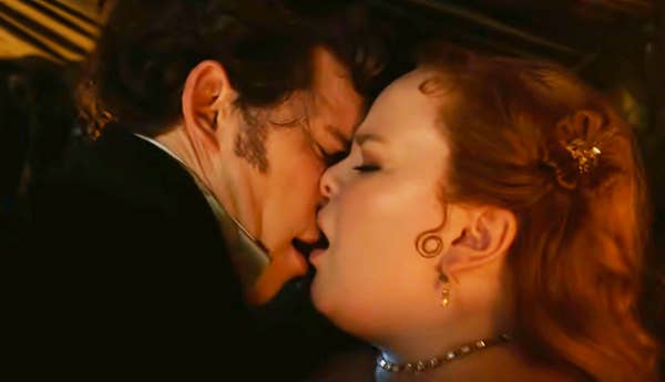 Nicola Coughlan and Luke Newton share a passionate kiss