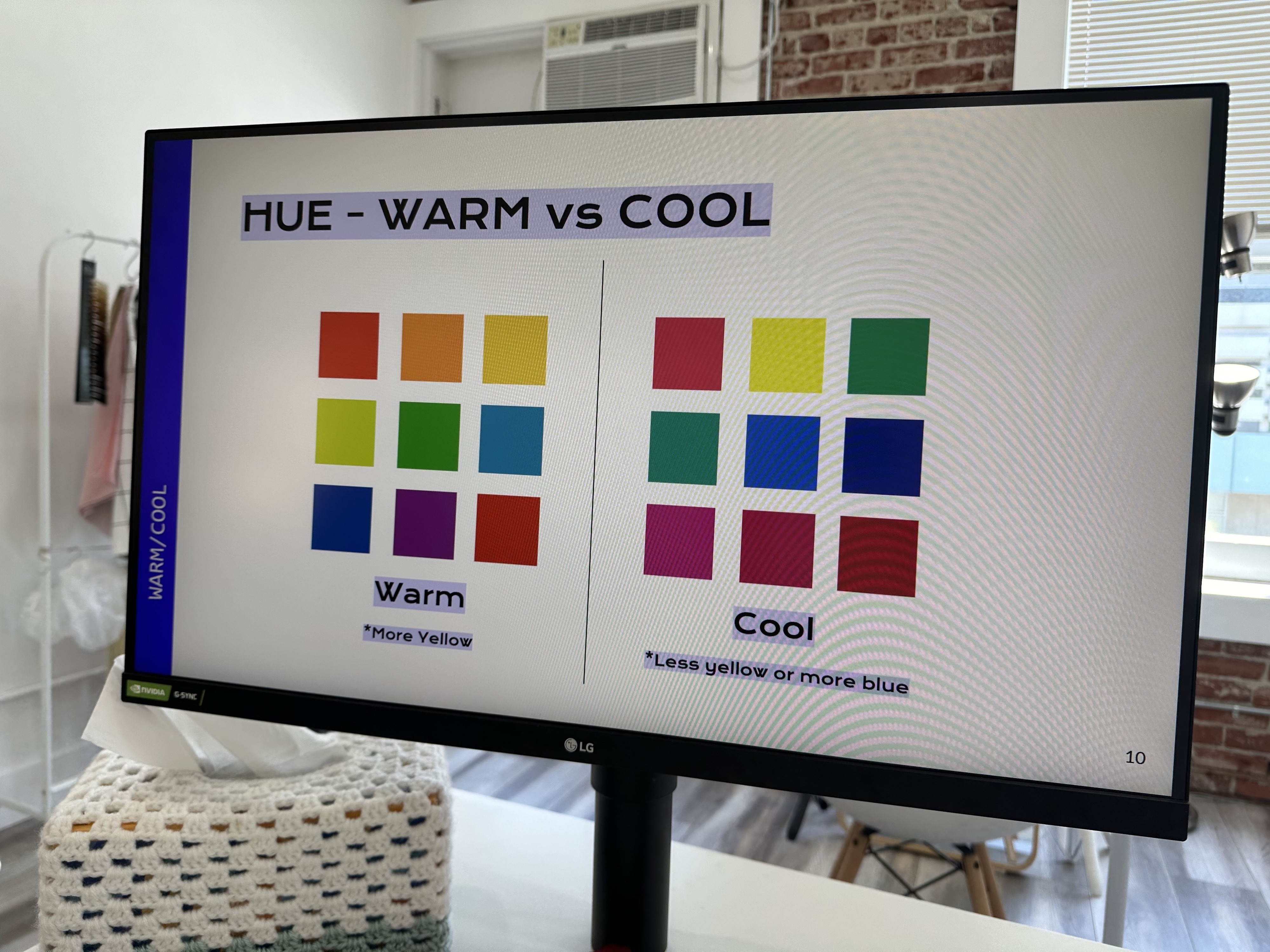 A computer screen shows a color comparison chart titled &quot;HUE - WARM vs COOL,&quot; displaying warm colors (more yellow) and cool colors (less yellow or more blue)