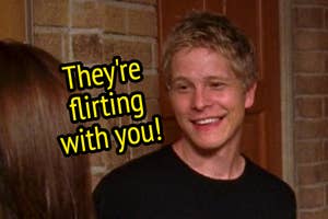 Logan Huntzberger from "Gilmore Girls" with the text "They're flirting with you" overlaid.
