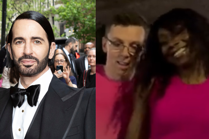 Marc Jacobs in a tuxedo at an event. Image also shows two unidentified individuals in pink shirts, smiling at the camera