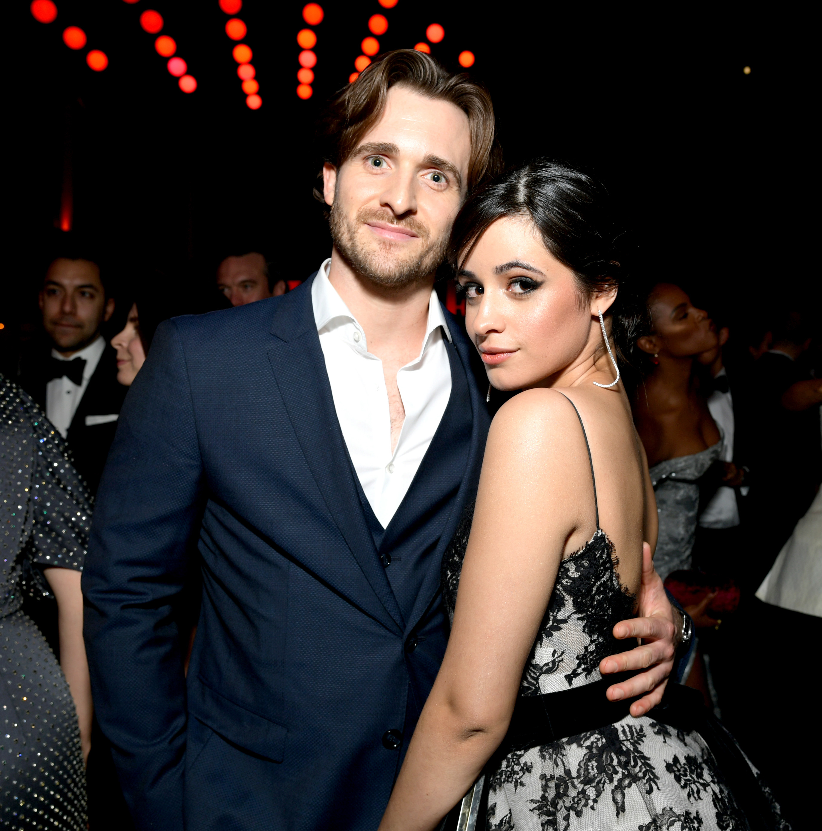 Camilla and Matthew pose together for a photo at an event
