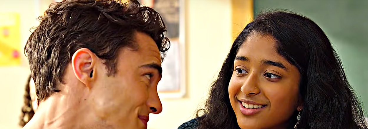 Darren Barnet and Maitreyi Ramakrishnan share a smile in a classroom, appearing to be in a conversation