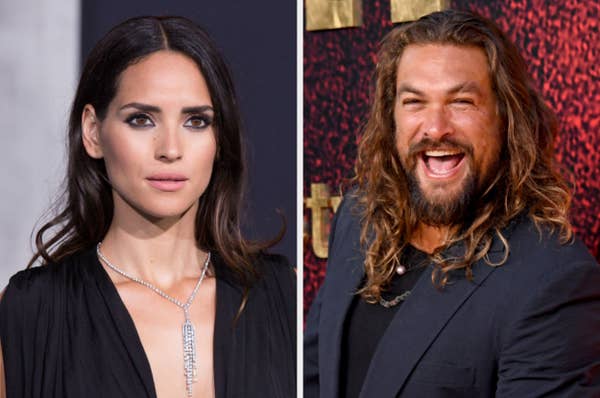 Adria Arjona wears a black gown with a silver necklace, and Jason Momoa smiles in a suit with long, wavy hair