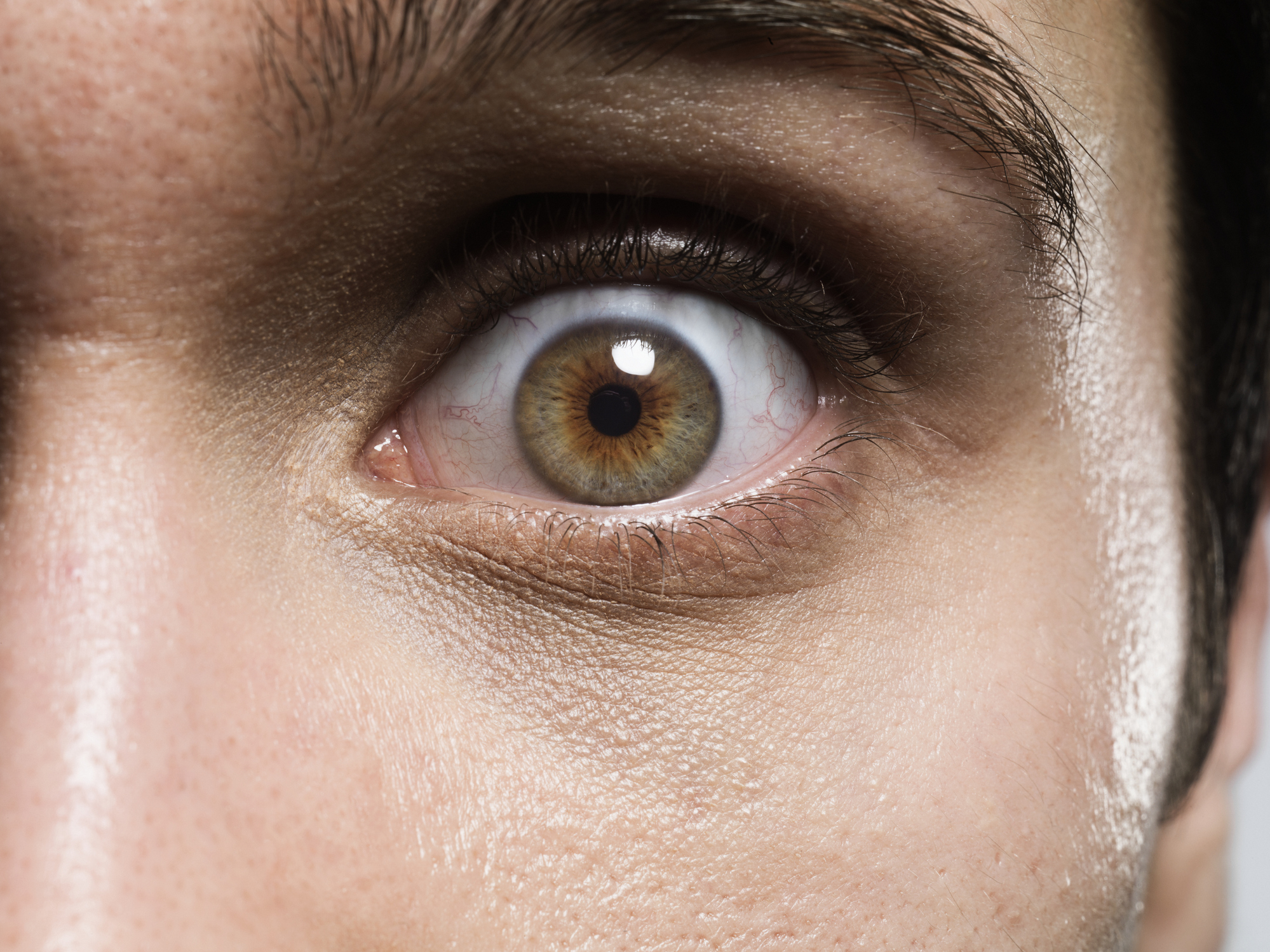 Close-up of a person's eye, showing detailed texture of the skin and eye