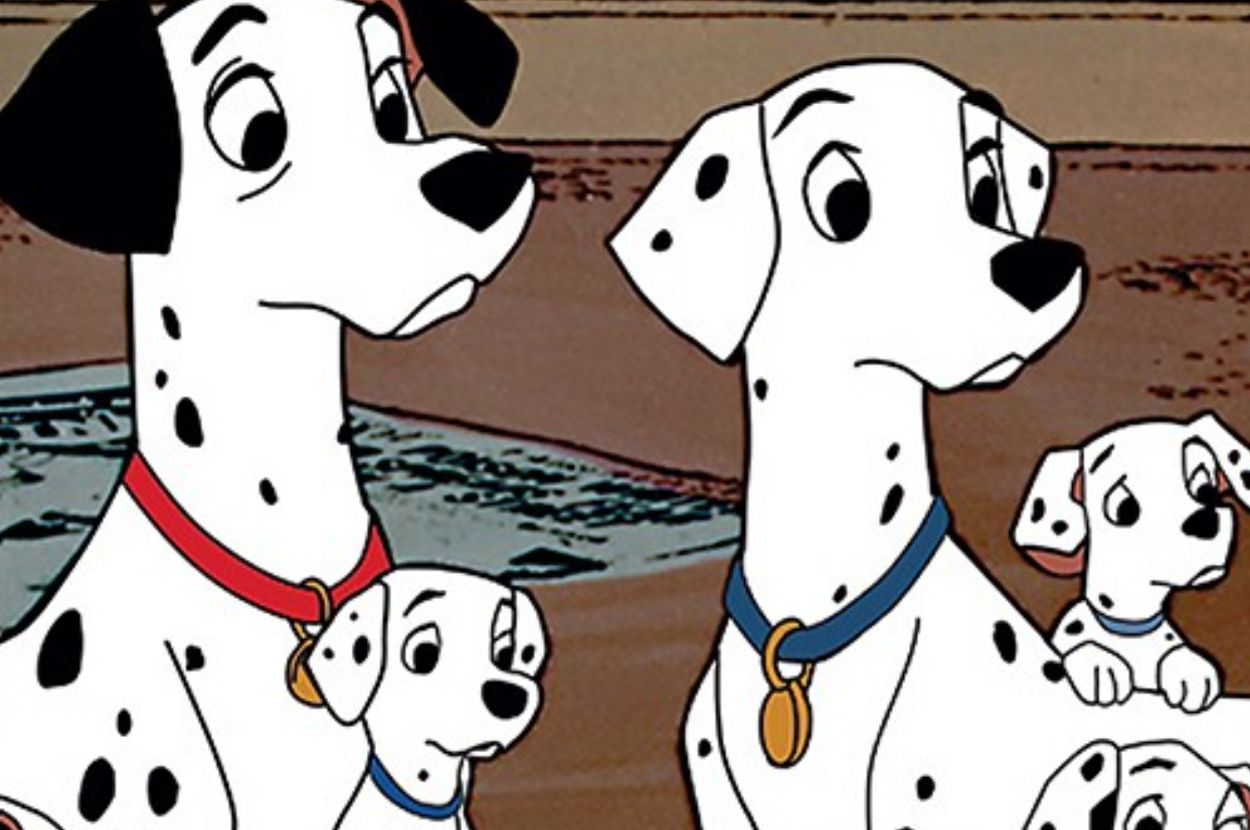 Animated Dalmatians Pongo and Perdita with two pups from "101 Dalmatians" sitting together, appearing content and engaged in conversation