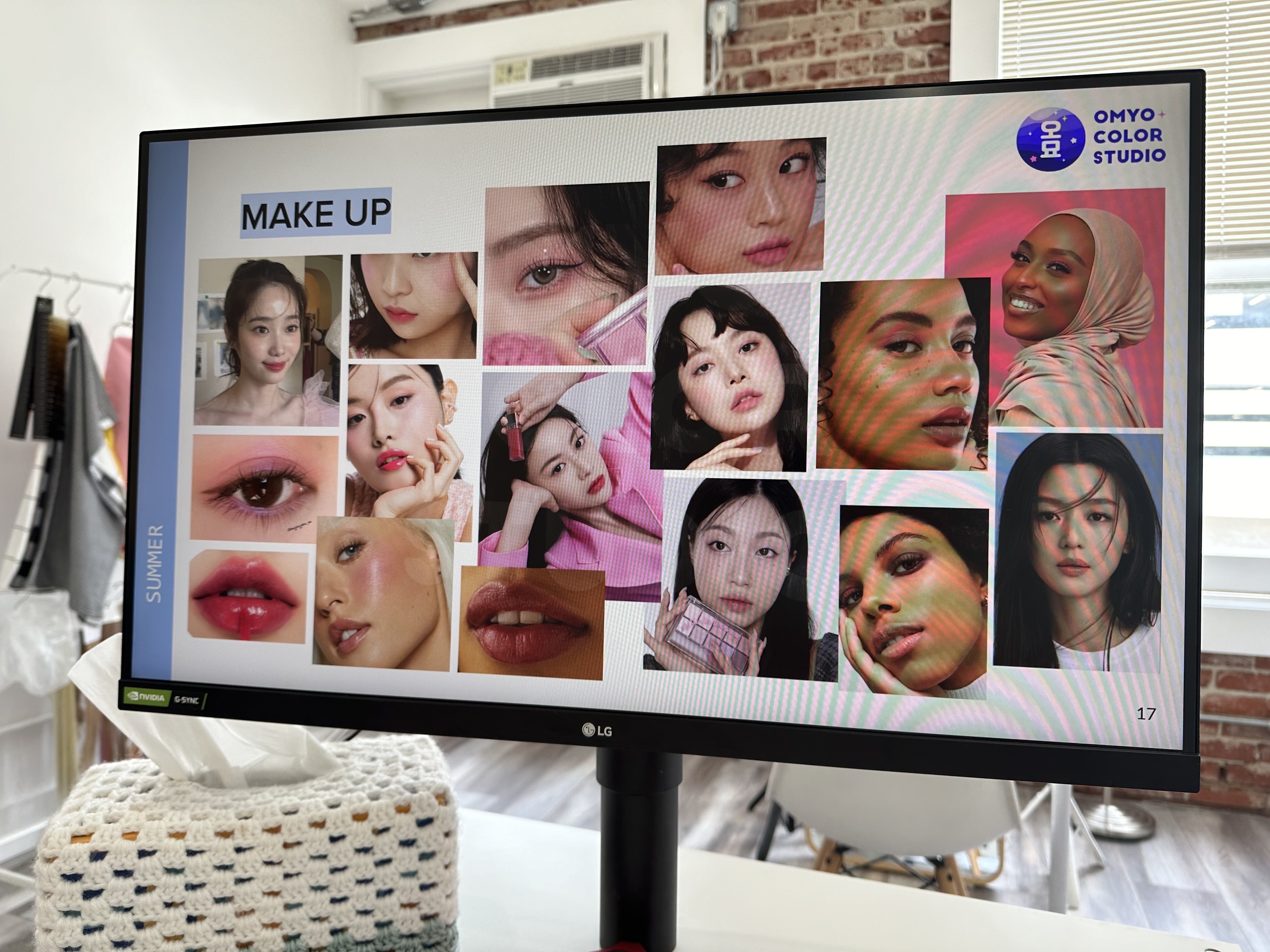 A computer screen displays a collage of makeup styles with models illustrating different makeup looks. The screen has the label &quot;OMYO COLOR STUDIO&quot; and &quot;MAKE UP&quot;