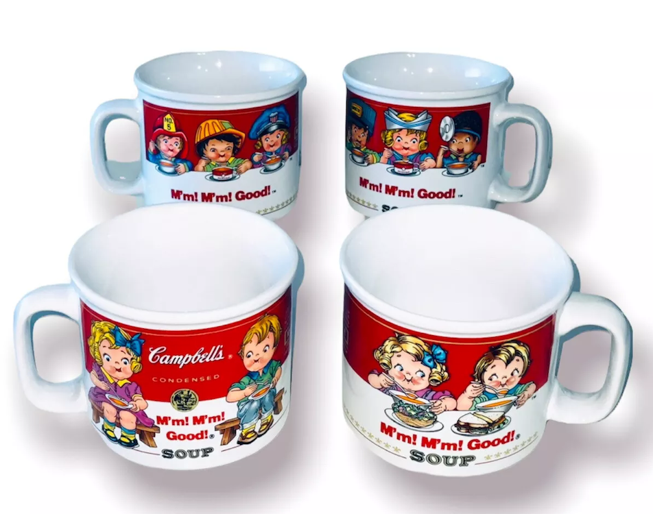 Four white mugs featuring retro Campbell's Soup ads with illustrated children enjoying soup, showing phrases "M'm! M'm! Good!"