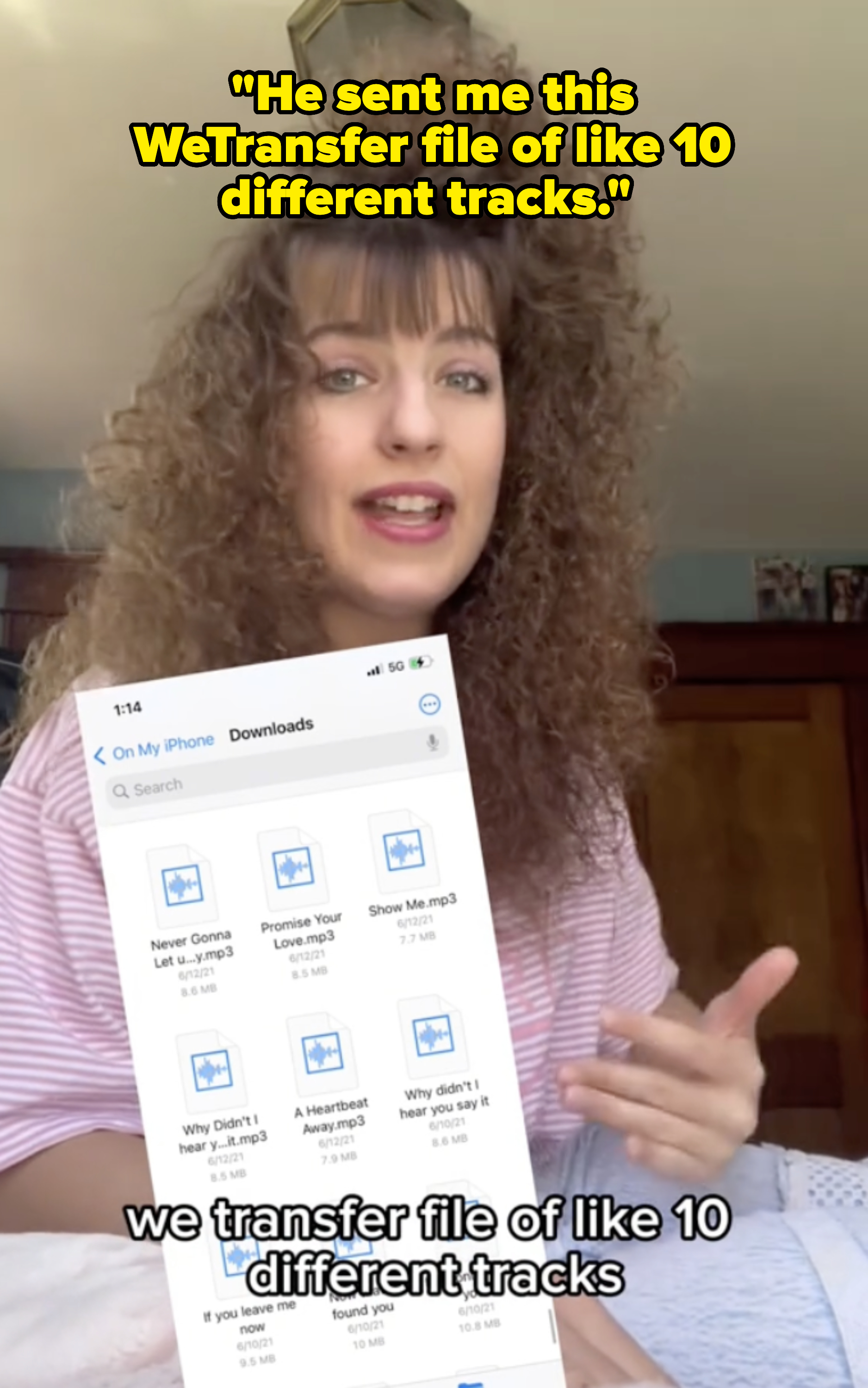 Woman with curly hair discusses transferred audio files on her phone, showing a list of downloaded MP3 tracks, including &quot;Never Gonna Let U.mp3&quot; and &quot;Promise You&quot;