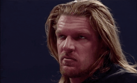 Triple H breaks into a smile