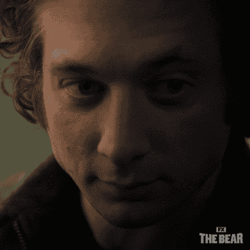 Jeremy Allen White looking contemplative in a close-up scene from FX's The Bear