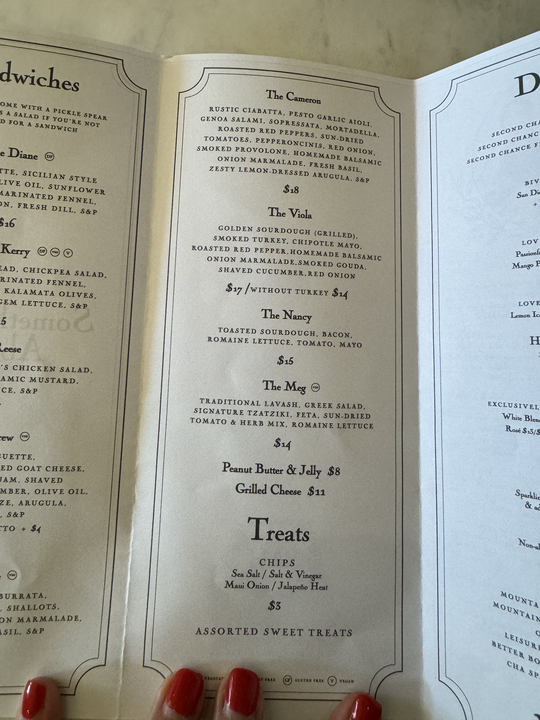 A menu with listed items: The Cameron, The Viola, The Nancy, The Meg, Peanut Butter &amp;amp; Jelly, Grilled Cheese, and assorted treats