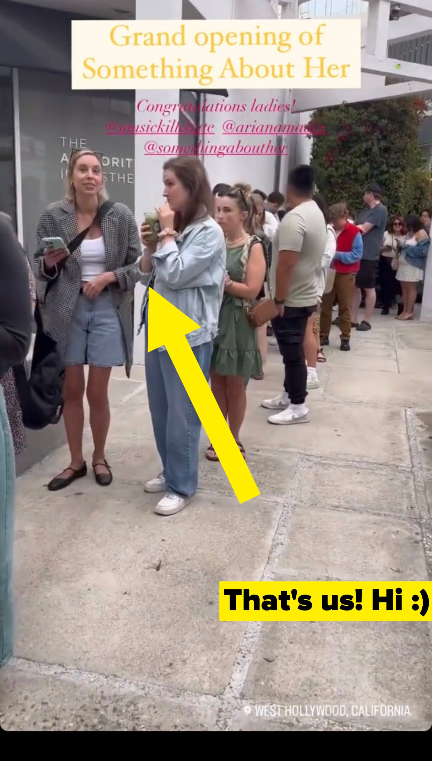 An Instagram story screenshot showing the line of people waiting outside a building for the grand opening of &quot;Something About Her&quot; with an arrow pointing at Lara