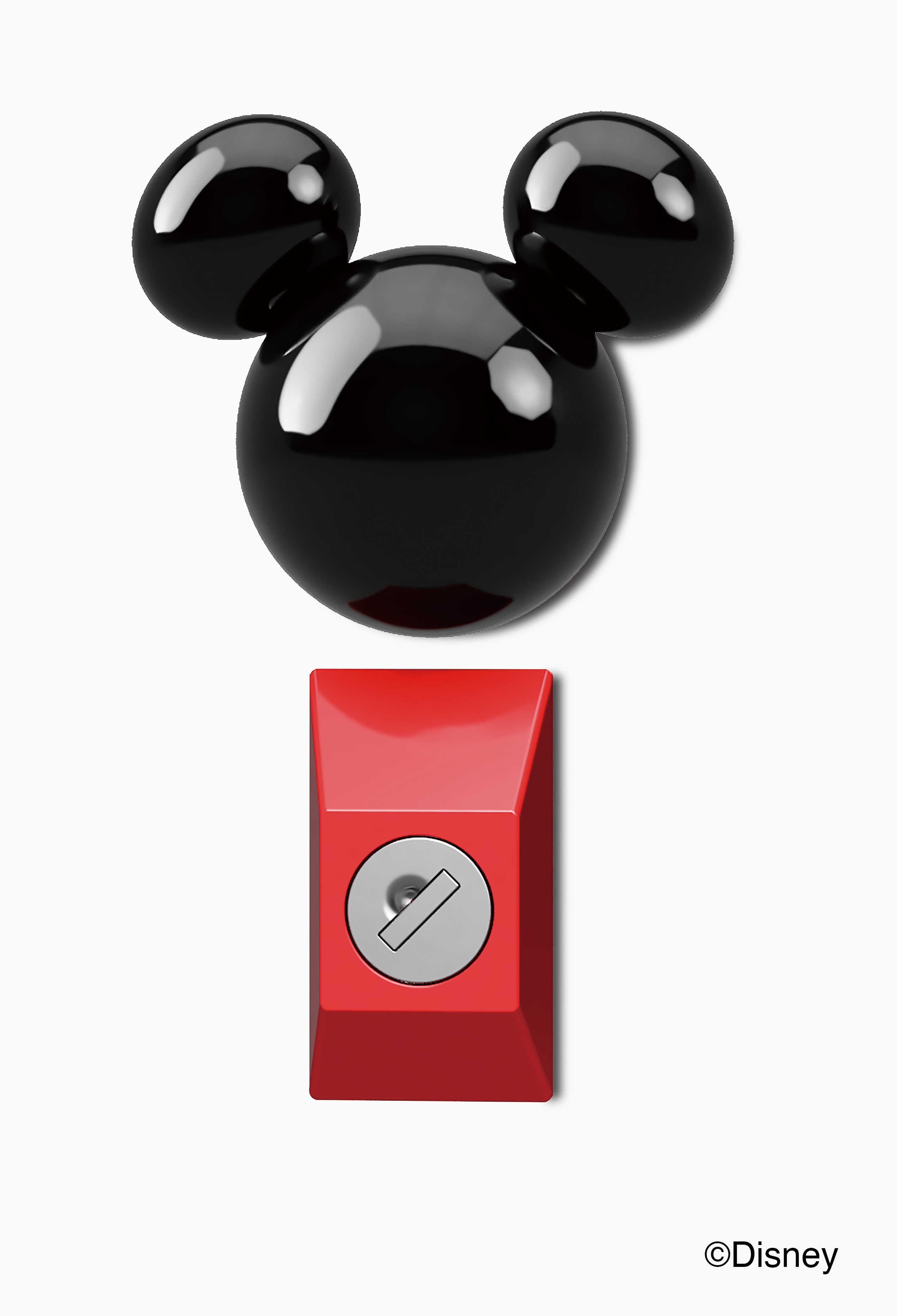 ミッキーマウスを模した黒いオブジェとその下にある赤いスイッチが写っています。
